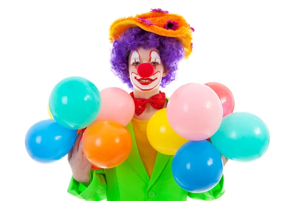 Barn klädd som färgglada rolig clown med ballonger — Stockfoto