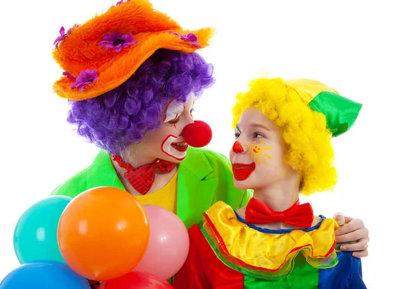 Two children dressed as colorful funny clown with balloons — Stock Photo, Image