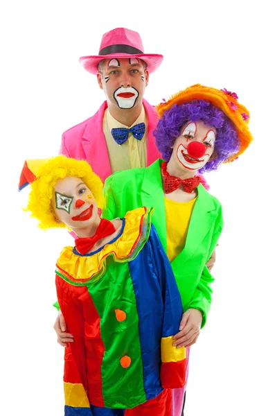 Drie verkleed als kleurrijke grappige clowns — Stockfoto
