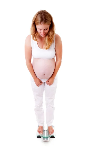 Pregnant woman on scale — Stock Photo, Image