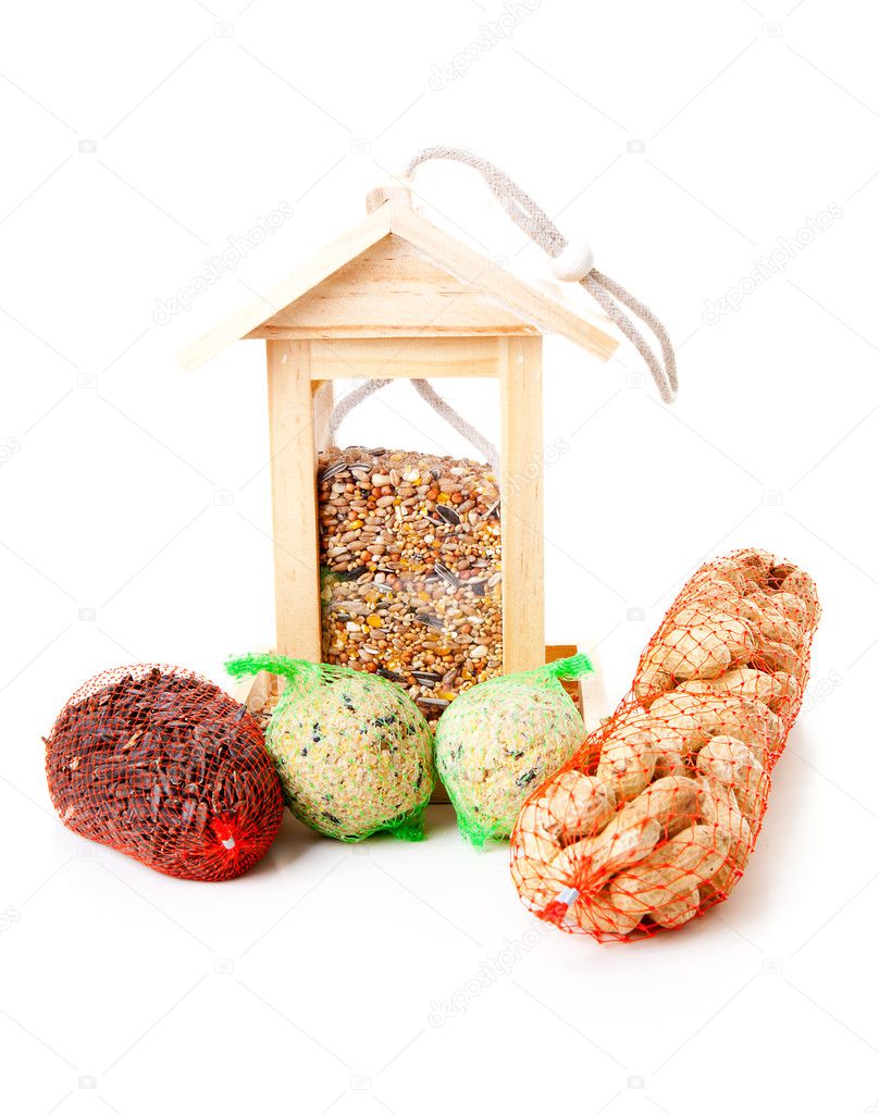Wooden bird feeder house with food