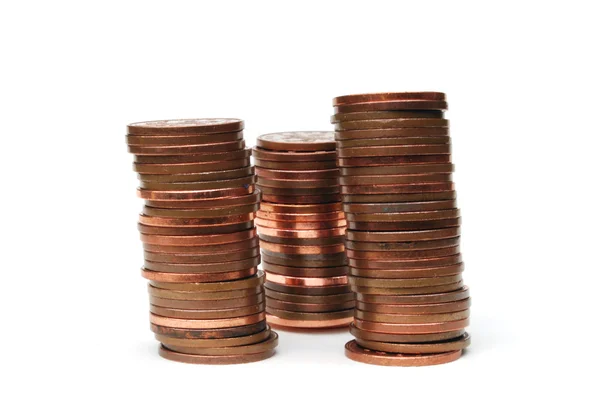 Três pilhas de moedas isoladas em branco — Fotografia de Stock