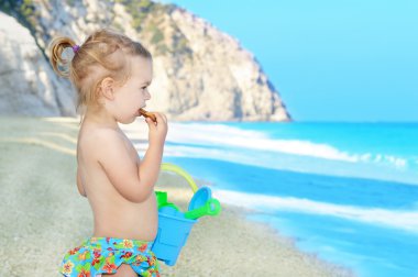 Happy child on the beach clipart