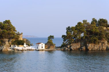 Old Greek orthodox church on island Panagias in Parga clipart