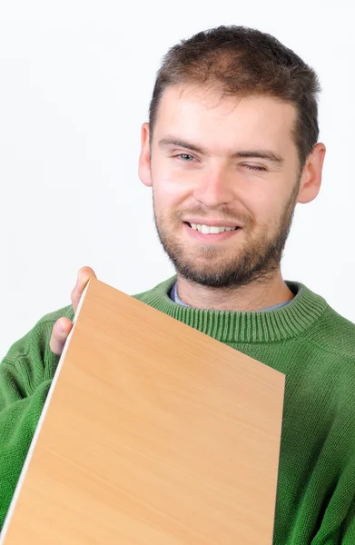 stock image Carpenter holding a wood board