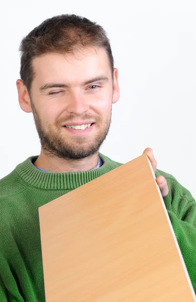 stock image Carpenter holding a wood board