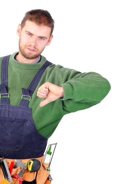 Real handsome carpenter showing thumb down — Stock Photo, Image