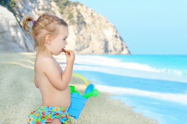 Happy child on the beach clipart