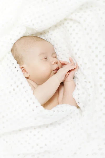 Sleeping newborn baby covered with white blanket — Stock Photo, Image