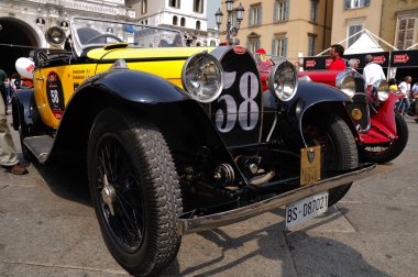 1930 built yellow Bugatti Type 40A at 1000 Miglia vintage car race in Brescia clipart