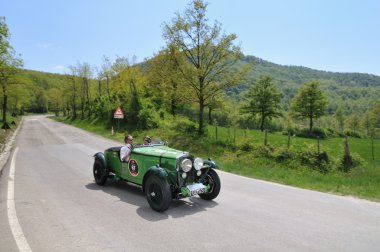 A green 1931 built Talbot AV 105 vintage car at 1000 Miglia vintage car race clipart