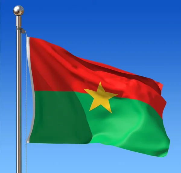 Burkina Fasos flagga mot blå himmel. — Stockfoto