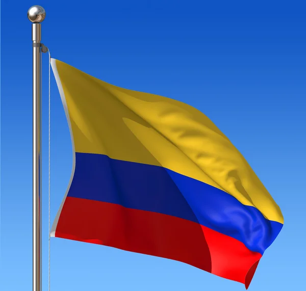 Vlajka Kolumbie proti modré obloze. — Stock fotografie