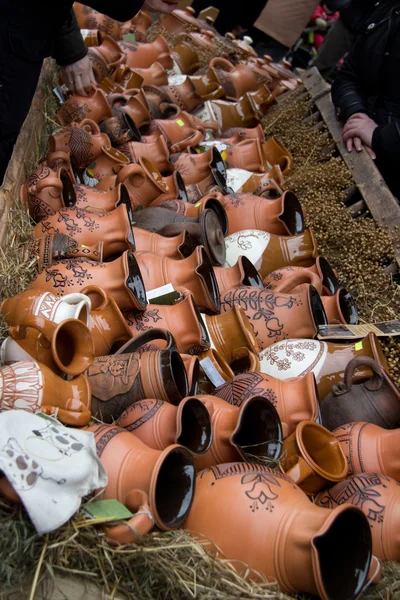 Many stone mugs at market Stock Photo