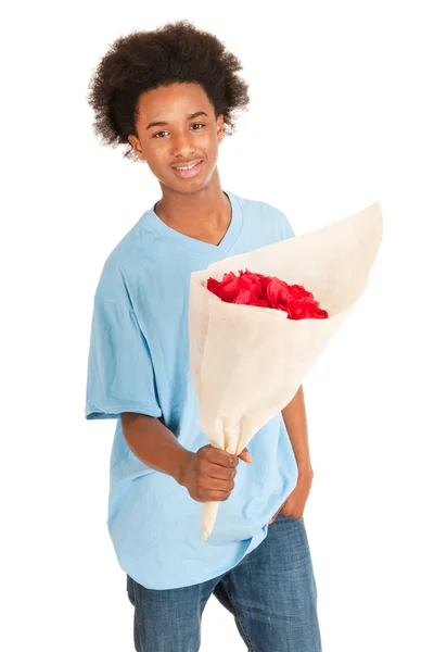 Black teen boy is giving flowers — Stock Photo, Image
