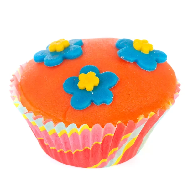 Oranje cupcake met blauwe bloemen — Stockfoto