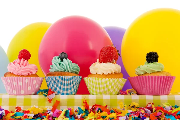 Birthday cupcakes with balloons — Stock Photo, Image