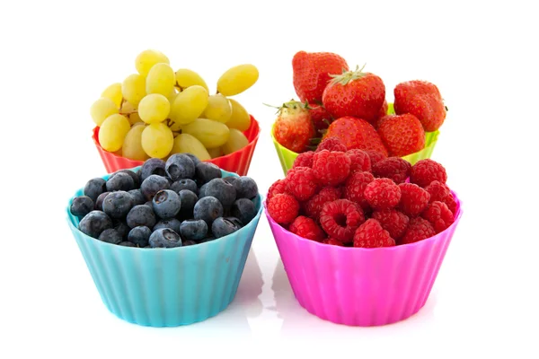 Fresh fruit in colorful cups — Stock Photo, Image