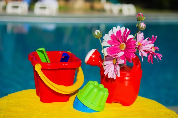 Toys near swimming pool — Stock Photo, Image