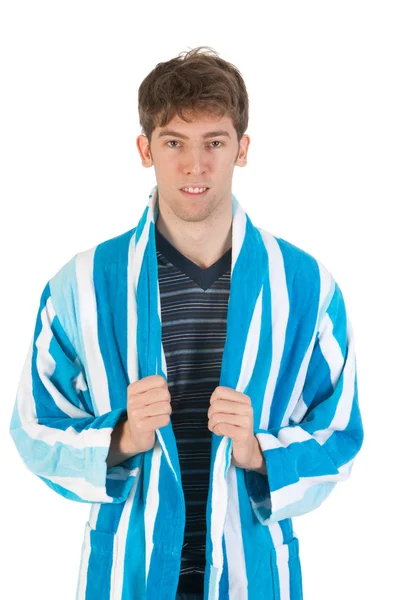 Молодой человек в пижаме и халате — стоковое фото