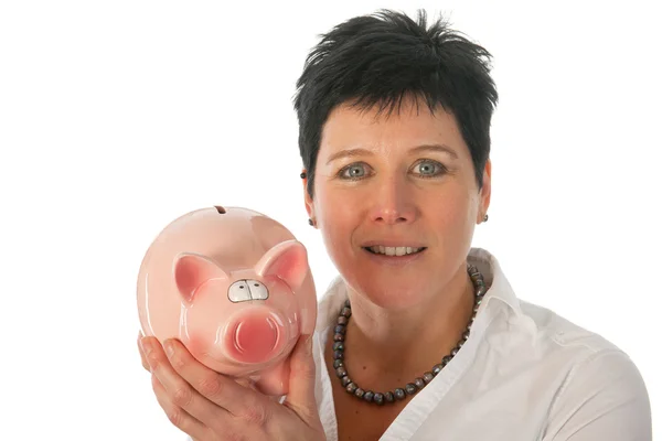 Woman is holding piggy bank — Stock Photo, Image