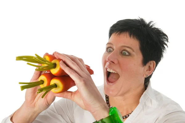 Woman with carrots — Stock Photo, Image