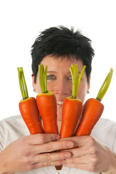 Vrouw met wortelen — Stockfoto