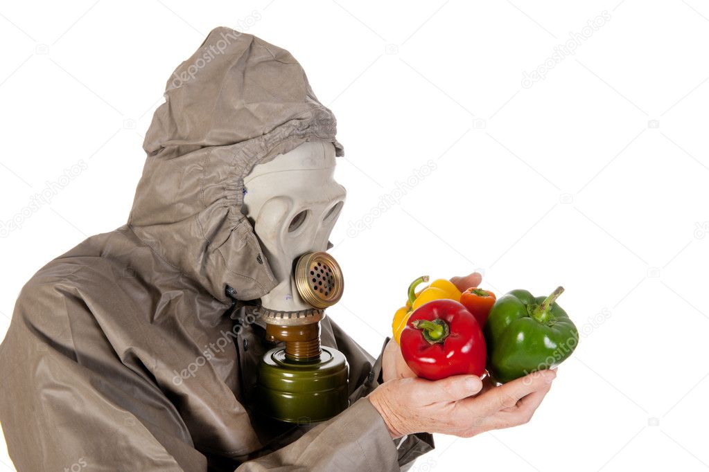 Man with gas mask and vegetables
