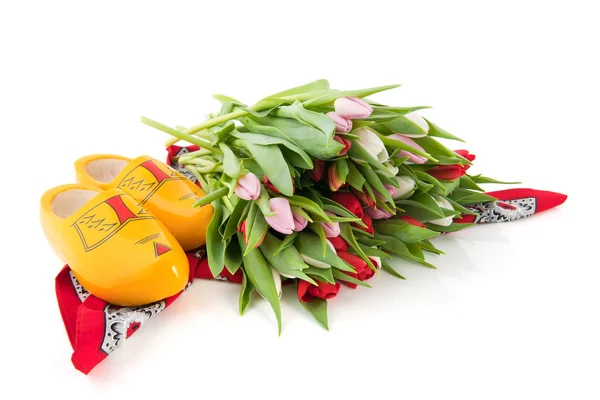 Dutch clogs and tulips — Stock Photo, Image