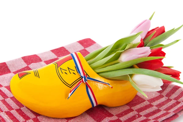 stock image Dutch wooden clogs with tulips