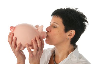 Young woman kissing piggy bank clipart