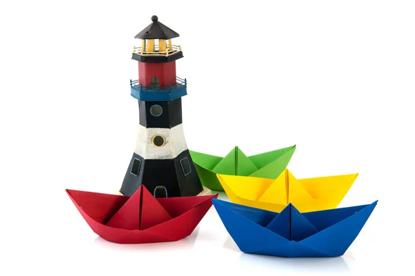 Colorful paper boats with lighthouse — Stock Photo, Image