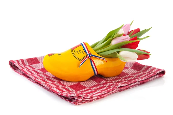 Dutch wooden clogs with tulips — Stock Photo, Image