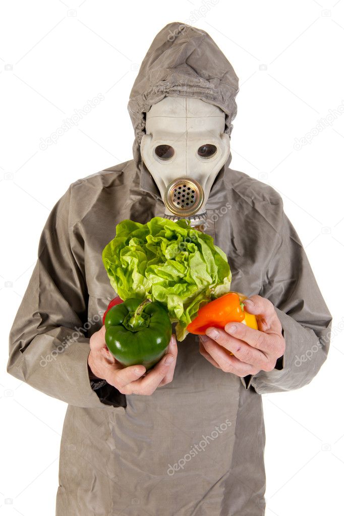 Man with gas mask and vegetables