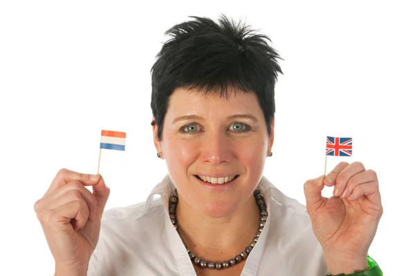 Jonge vrouw met Engels Nederlands vlaggen — Stockfoto
