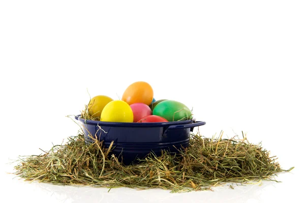 Blue bucket colorful easter eggs — Stock Photo, Image