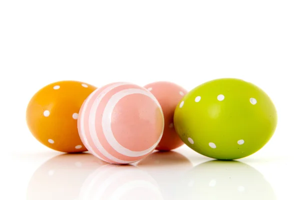Easter eggs in pink yellow and green — Stock Photo, Image