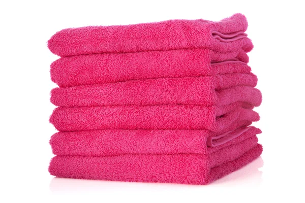 Gestapelde roze handdoeken — Stockfoto
