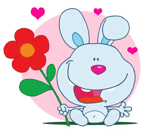 Happy bunny drží květ — Stock fotografie