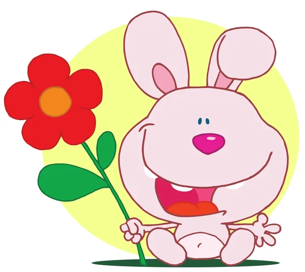 Glad rosa kanin håller en blomma — Stockfoto