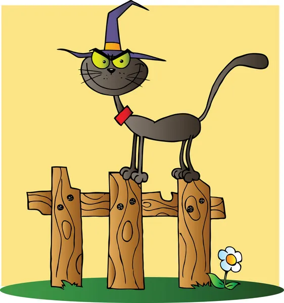 Sarı bir çitin üzerinde Halloween cadı kedi — Stok fotoğraf