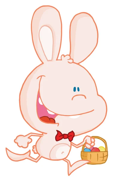 Szczęśliwy blado różowego królika z pisanek w koszyku — Zdjęcie stockowe