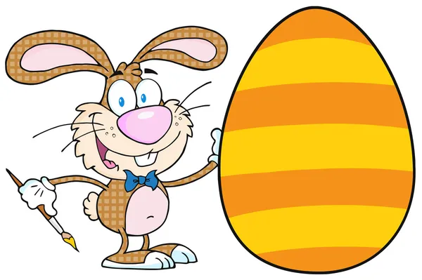 Bunny obraz velikonoční vajíčko s oranžové pruhy — Stock fotografie