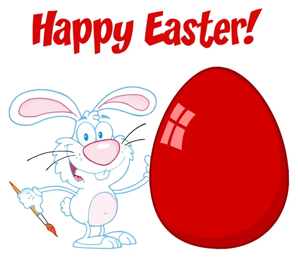 Beyaz mutlu Paskalya tavşanı kırmızı yumurta boyama — Stok fotoğraf
