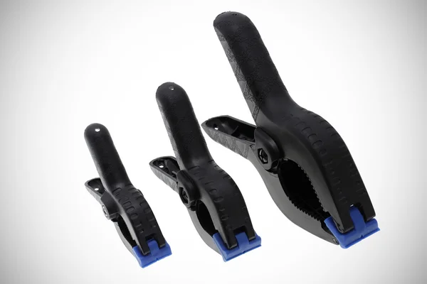 Three plastic clamps composition — Stock Photo, Image