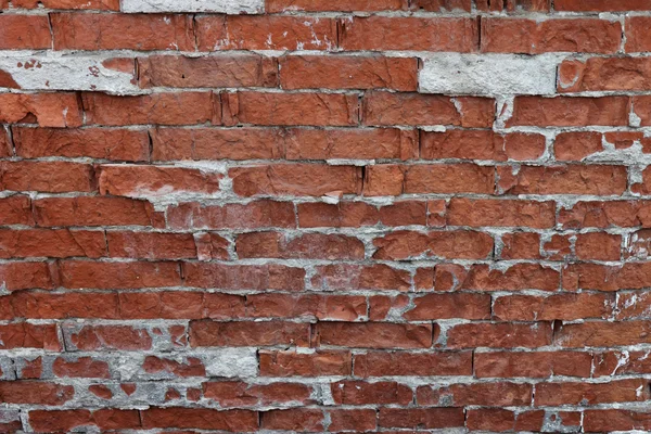Velho fragmento de parede de tijolo resistido — Fotografia de Stock