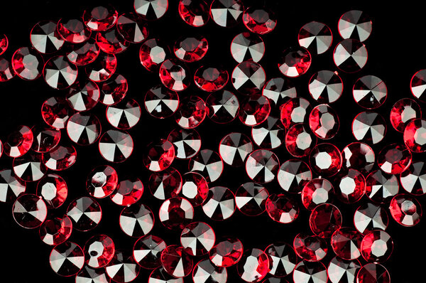 The red crystal on a black background .