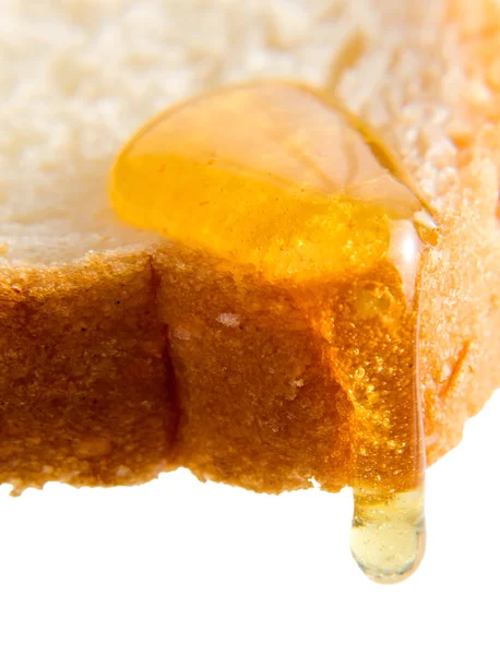 Honung på en bröd. — Stockfoto
