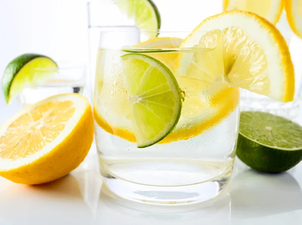 Drinks with lemon and lime. — Stock Photo, Image