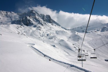 Skiers on ski slopes clipart